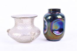 Iridescent squat shaped vase and one other lustre glass vase.