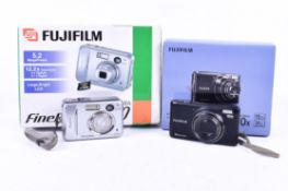 Two boxed Fujifilm FinePix compact digital cameras.