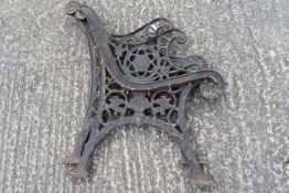 A pair of early 20th Century decorative cast iron bench ends.