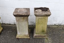 A pair of reconstituted stone square form pedestals. H71cm.