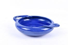 C H Brannam Art Nouveau circular blue glazed bowl having handles, stamped 'Made for Liberty & Co.