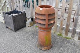 A terracotta chimney pot.
