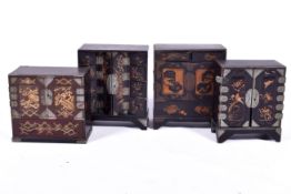 Four Japanese lacquer table top drawers in the Tansu manner. One locked with no key present.