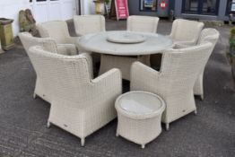 A 'Life' set of cream rattan garden table and eight armchairs and a side table.
