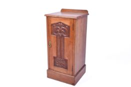 Art Nouveau carved mahogany pot cupboard. Raised on a plinth base.
