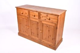 A 20th Century farmhouse style pine sideboard unit.