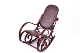 A 20th Century bentwood style rocking chair. Upholstered in faux leather with stitch effect detail.