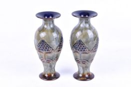 Pair of Royal Doulton stoneware vases having stylised Art Nouveau decoration of trees.