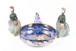 Three Doulton figures and a decorative bowl depicting flowers and butterfly.