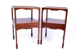 A pair of 20th century Georgian style mahogany nightstands.