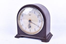 Smiths Enfield Bakelite cased mantel timepiece. Having Arabic numerals, pendulum present.