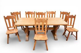 A 20th Century Dutch farmhouse style oak dining table and eight chairs.