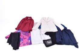 An assortment of ladies designer and high end clothing.