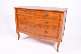A 19th Century style serpentine commode chest of drawers.