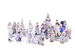 A collection of assorted porcelain figures mostly continental.