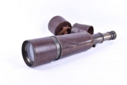 A five draw brass telescope stamped 'Dollond'. Bound in brown leather with end caps.
