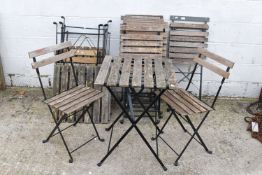 Eleven bistro style folding garden chairs & six tables.