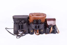 Two pairs of Carl Zeiss binoculars together with a pair of military binoculars