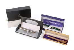 A collection of three boxed pens, A green Waterman Paris fountain pen,