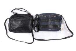 Two Radley handbags. One blue and black striped. Working zip, lined with zip pocket to the interior.