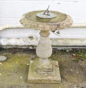 A reconsituted stone garden sundial.