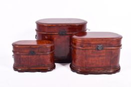 A set of three 20th Century oriental style graduated boxes. Burgundy fabric lined interiors.