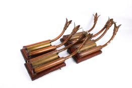 A set of four scratch built 'Brutalist' style brass and copper wall lights.