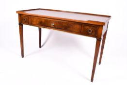 A 20th century Georgian style oak writing table or desk with three drawers.