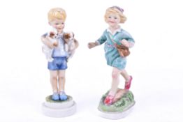 Two Royal Worcester days of the week figures. Monday's child (boy) and Thursday's Child (girl).
