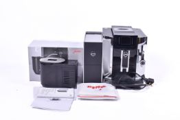 A Jura E8 coffee machine type 735, cup warmer Type 571 and a cool control 592.