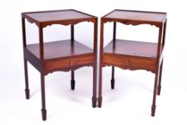 A pair of 20th century Georgian style mahogany nightstands.
