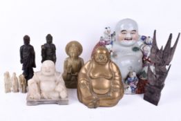 A ceramic seated Buddha and other Buddha figures.