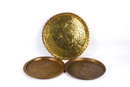 Three brass Far Eastern style round trays.