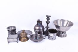 A quantity of pewter and other metalware to include bowls and candlesticks.