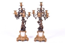 Pair of gilt brass candelabra with marble columns.