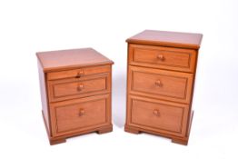 A pair of Stag bedside chests. Having a slide and two drawers.