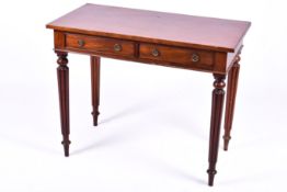 A 20th century Regency style mahogany library or writing table.