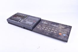 Kawai R-50e digital drum machine and a Fostex X-28 multitrack recorder.