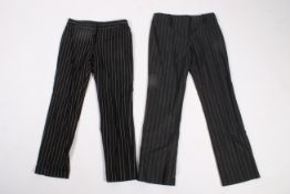 Two pairs of ladies designer pinstripe trousers.