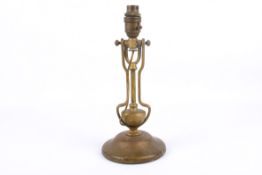A brass ship's gimbal wall or desk lamp. Having a circular weighted base.