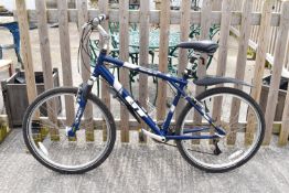 A blue GT Timberline 24 speed mens bicycle. 26' wheels.