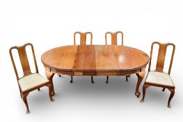 A late 19th century mahogany extendable dining table and a set of four Queen Anne style dining