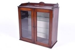 An Edwardian glazed mahogany wall display cabinet.