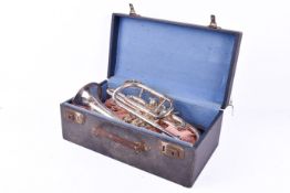 A Class A Boosey & Co light valve trumpet in fitted case with decorative engraving.