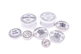 Two lidded relish pottery dishes and a further six lids for anchovy paste,