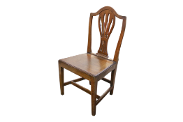 An 18th century oak Hepplewhite style English country side chair.