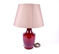 A contemporary Chinese sang de boeuf style baluster vase table lamp.