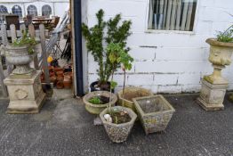 A collection of four assorted reconstituted stone pots and one glazed example.