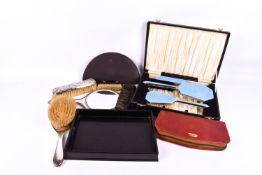 A group of assorted dressing table items.