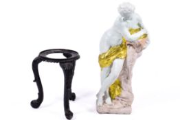 Painted composite figure along with a Victorian cast iron tripod base.